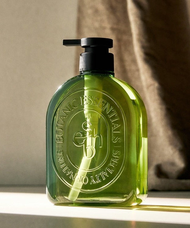 ESSENHERB Acne Tea Tree Daily Body Wash 500ml in green bottle on counter