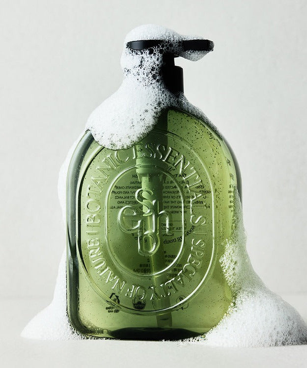 ESSENHERB Acne Tea Tree Daily Body Wash 500ml bottle with foam on white background