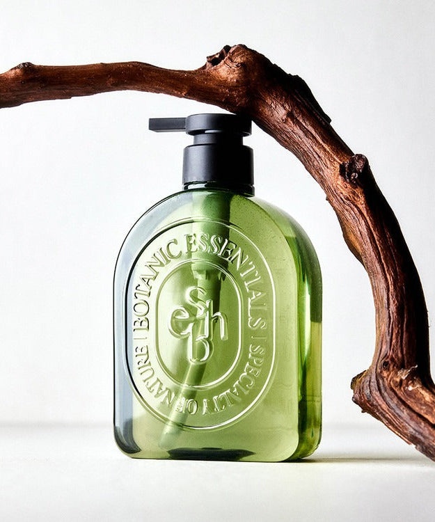 Bottle of ESSENHERB Acne Tea Tree Daily Body Wash 500ml with natural aesthetic design