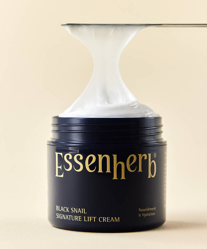 ESSENHERB Black Snail Signature Lift Cream 50ml jar with cream being applied, showcasing texture and packaging.