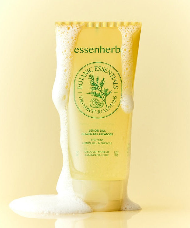 ESSENHERB Lemon Dill Glazed Gel Cleanser 150ml with soap suds on a yellow background