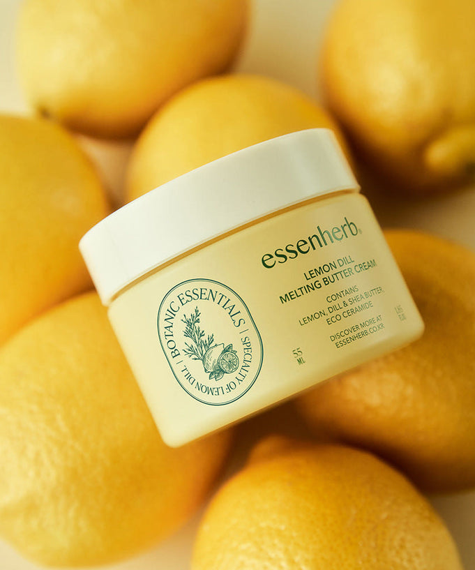 ESSENHERB Lemon Dill Melting Buttercream 55ml jar with fresh lemons backdrop