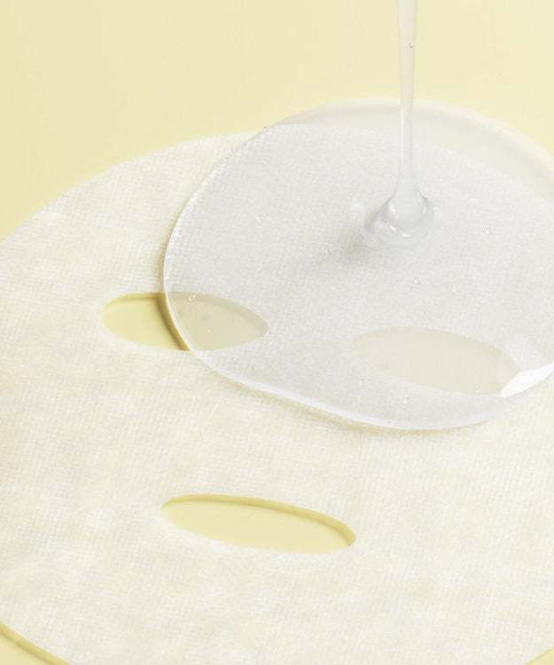 ESSENHERB Lemon Dill Radiant Glow Cotton Mask 5EA with hydrating serum being applied, enhancing skin radiance.