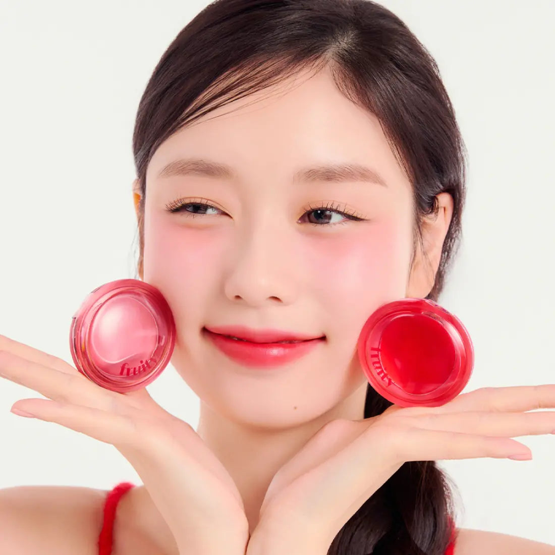 Model with ETUDE Fruity Lip & Cheek Blur Balm 2.3g in vibrant pink shade