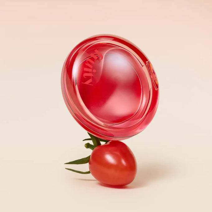 ETUDE Fruity Lip & Cheek Blur Balm 2.3g displayed with a cherry tomato, showcasing its vibrant, fruity aesthetic.
