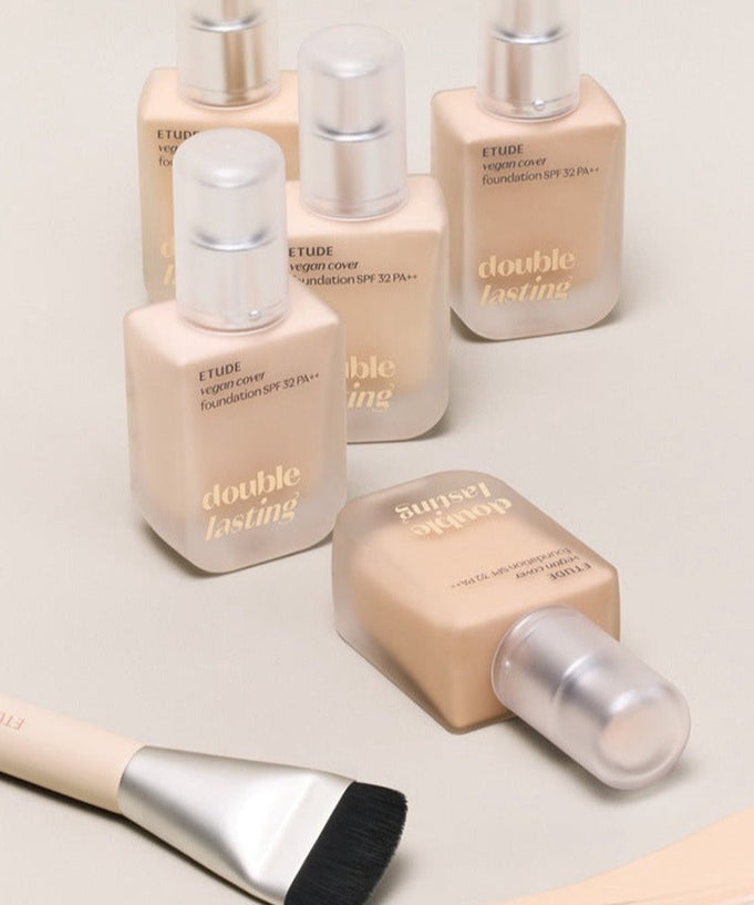 ETUDE Double Lasting Vegan Cover Foundation 30g bottles with brush on a beige background