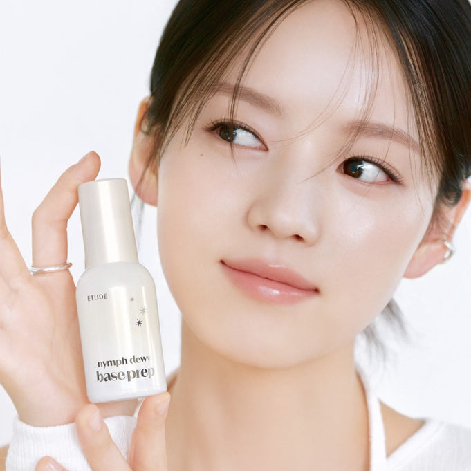 Woman holding ETUDE Nymph Dewy Base Prep 30ml