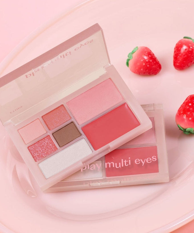 ETUDE Play Multi Eyes palette with vibrant shades on a pink background, perfect for creating versatile eye looks.