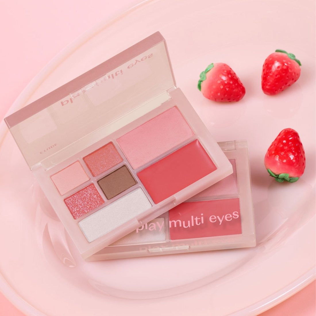 ETUDE Play Multi Eyes palette with vibrant shades on a pink background, perfect for creating versatile eye looks.