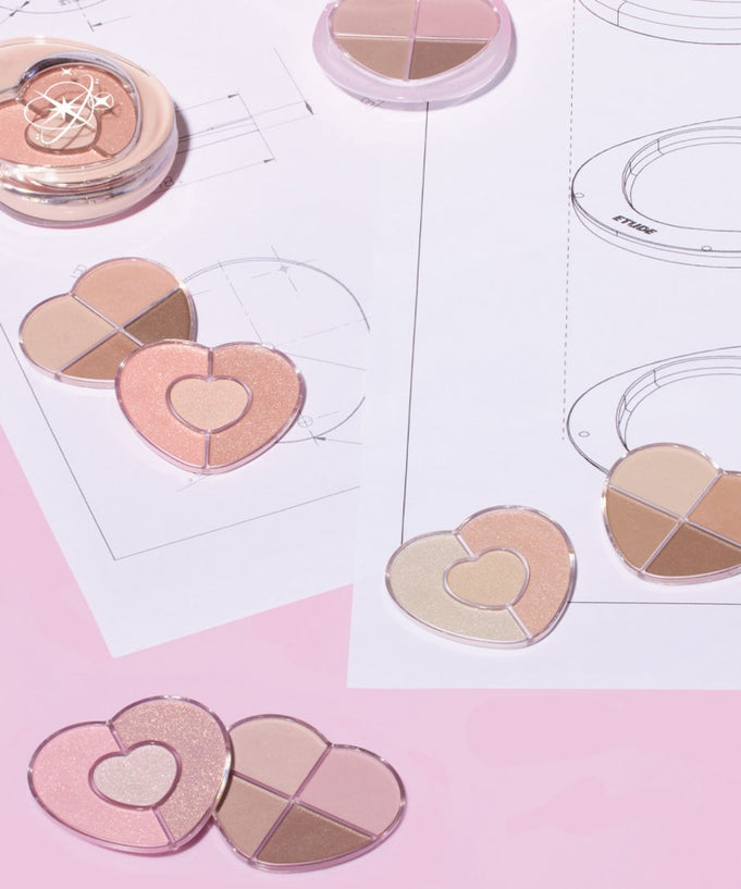 ETUDE Poyong Eye Maker heart-shaped eyeshadow palettes displayed on pink background with design sketches.