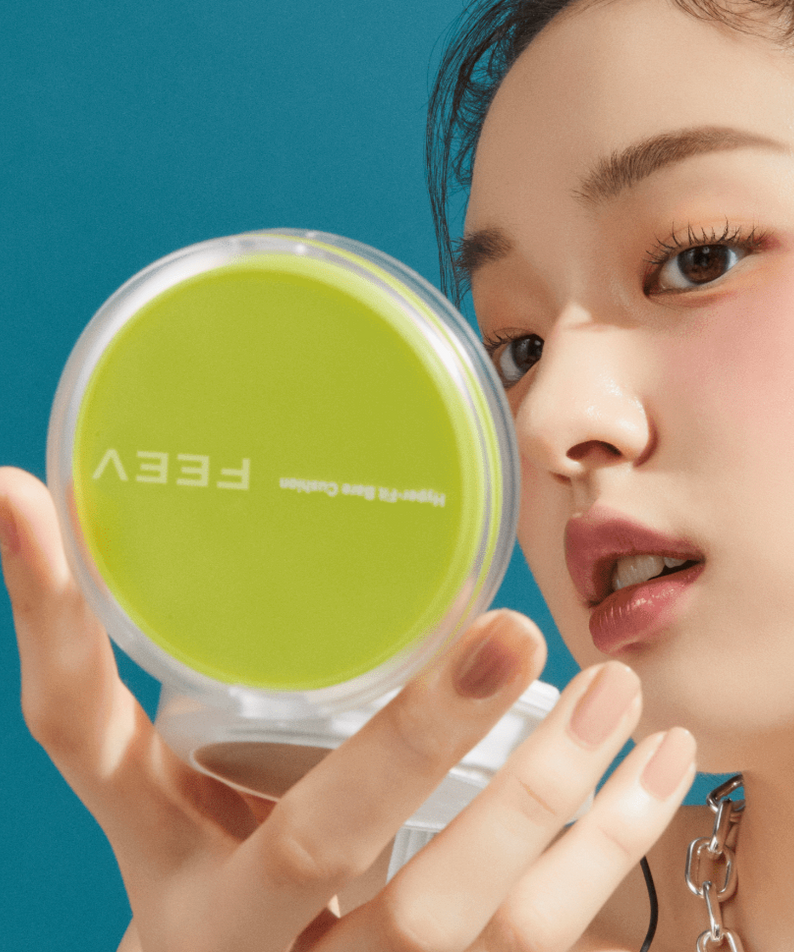 Model holding FEEV Hyper-Fit Bare Cushion Set in a vibrant blue background.