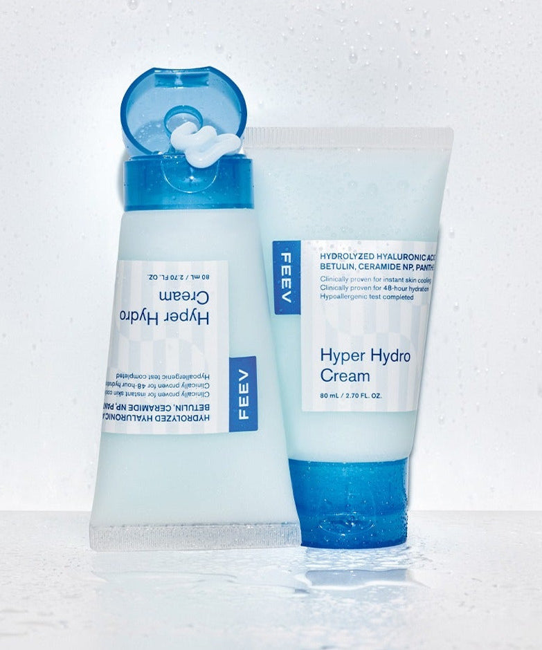 FEEV Hyper Hydro Cream 80ml with hydrating formula in two blue and white tubes on wet surface.