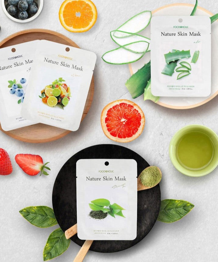 FOODAHOLIC Nature Skin Mask 1+1 with fresh natural ingredients displayed on a table