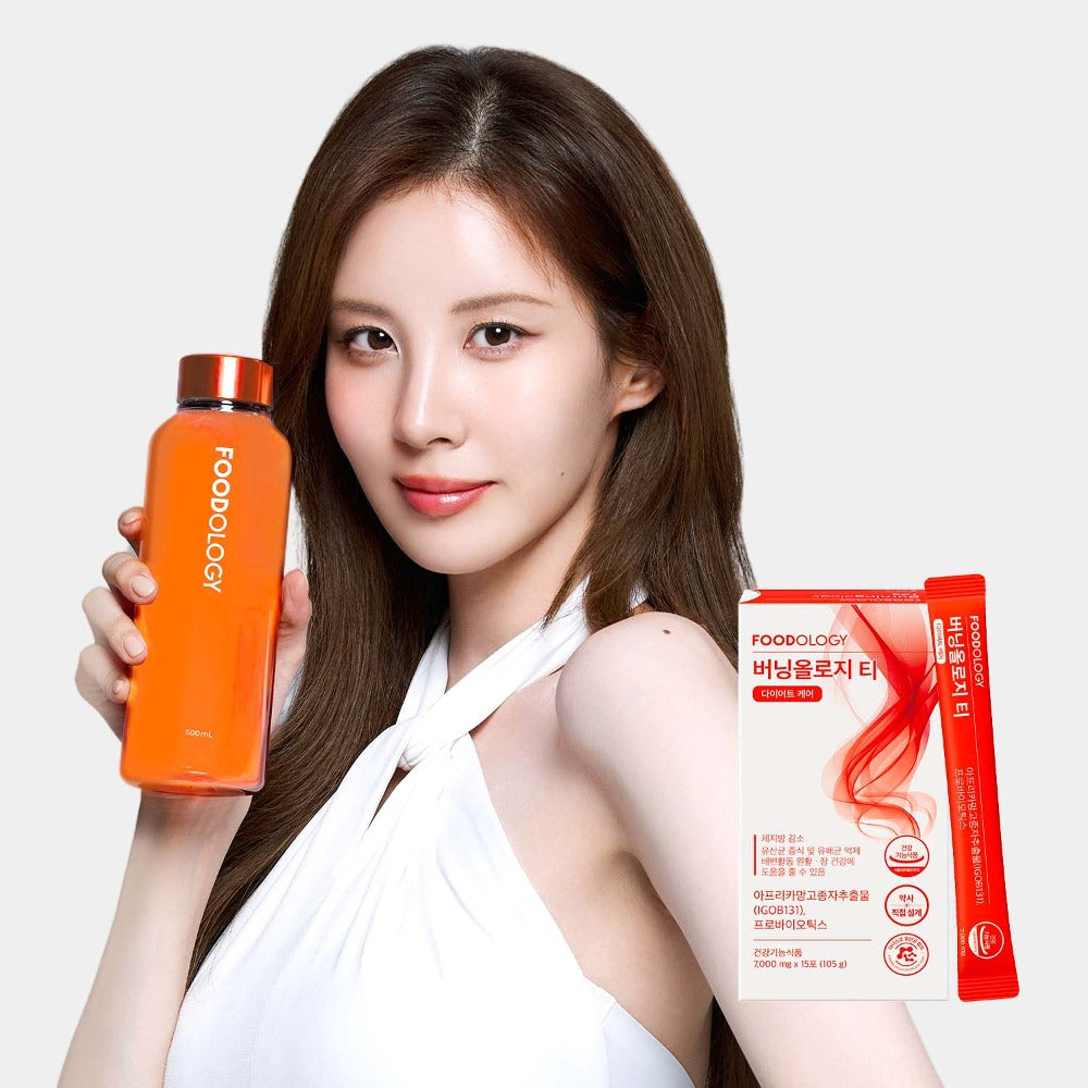 Woman holding FOODOLOGY Burningology tea (x15) with product packaging displayed.