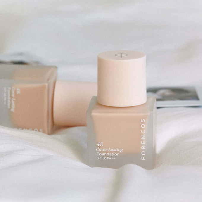 FORENCOS 4K Cover Lasting Foundation 30ml on a white background showcasing elegant packaging design.