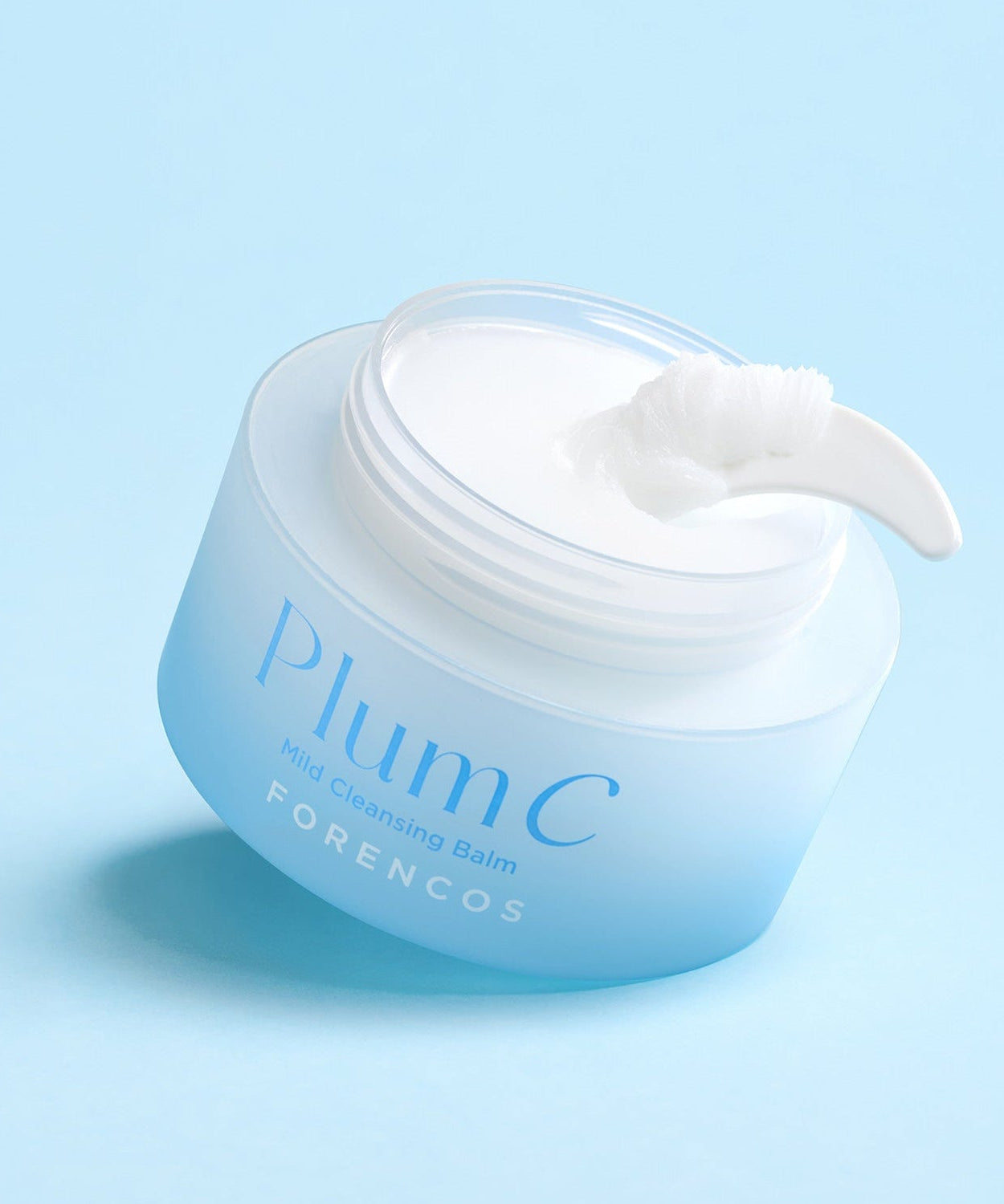 FORENCOS Plum C Mild Cleansing Balm 50ml in open jar with spatula on blue background