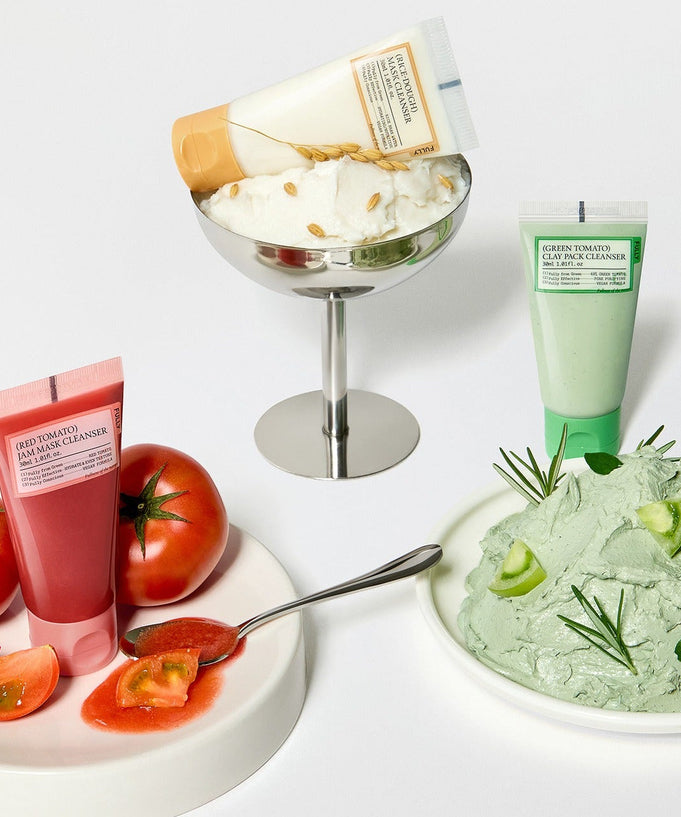 FULLY Fully Pack Cleanser 3-piece set including red, green, and white cleanser tubes next to fresh ingredients on display.