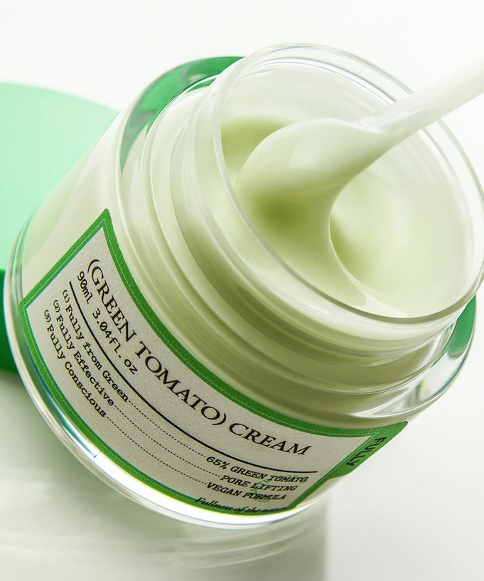 Open jar of FULLY Green Tomato Cream 90ml with a close-up of the smooth green cream and product label.