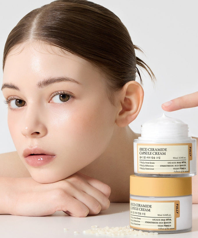 Woman showcasing FULLY Rice Sera Capsule Cream 90ml jar with smooth, glowing skin.