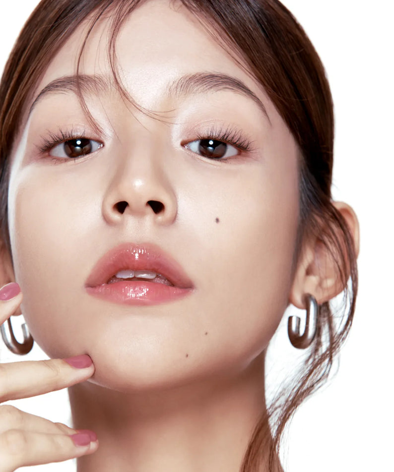 Woman wearing FWEE 3D Voluming Gloss for enhanced lip volume and shine