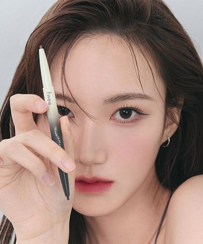 Woman holding FWEE Oltime Dual Liner with a focus on eye makeup application.