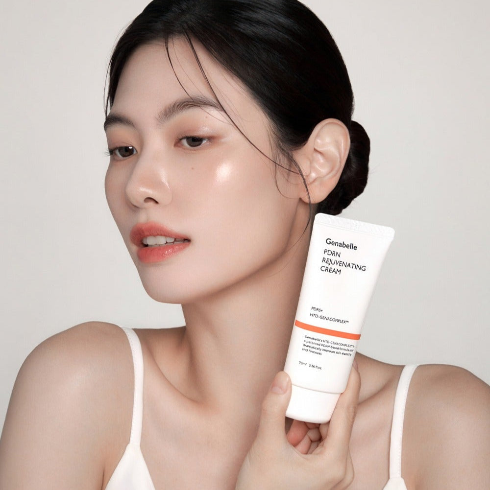 Woman holding GENABELLE PDRN Rejuvenating Cream 70ml, showcasing skincare product.