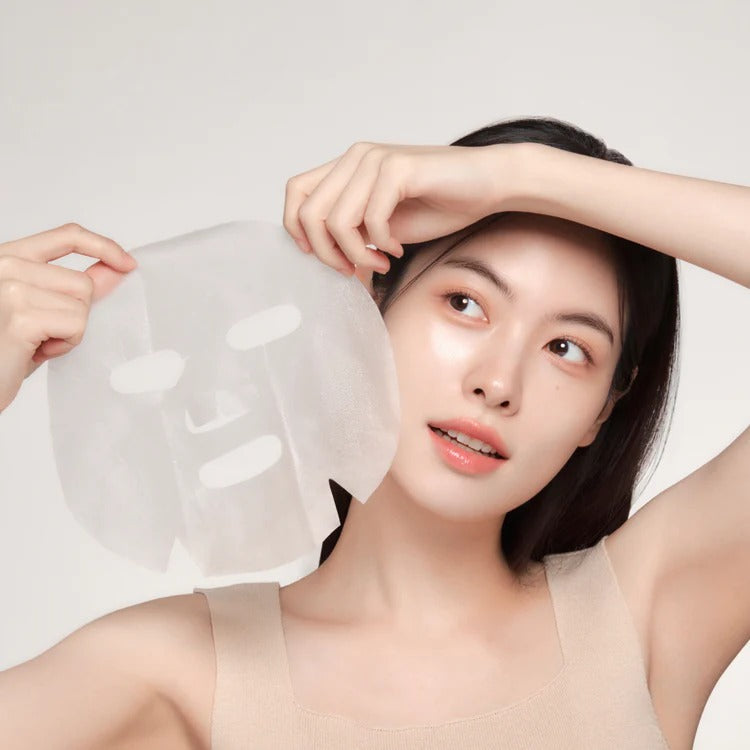 Woman holding GENABELLE PDRN Rejuvenating Mask 5ea, showing skincare effect