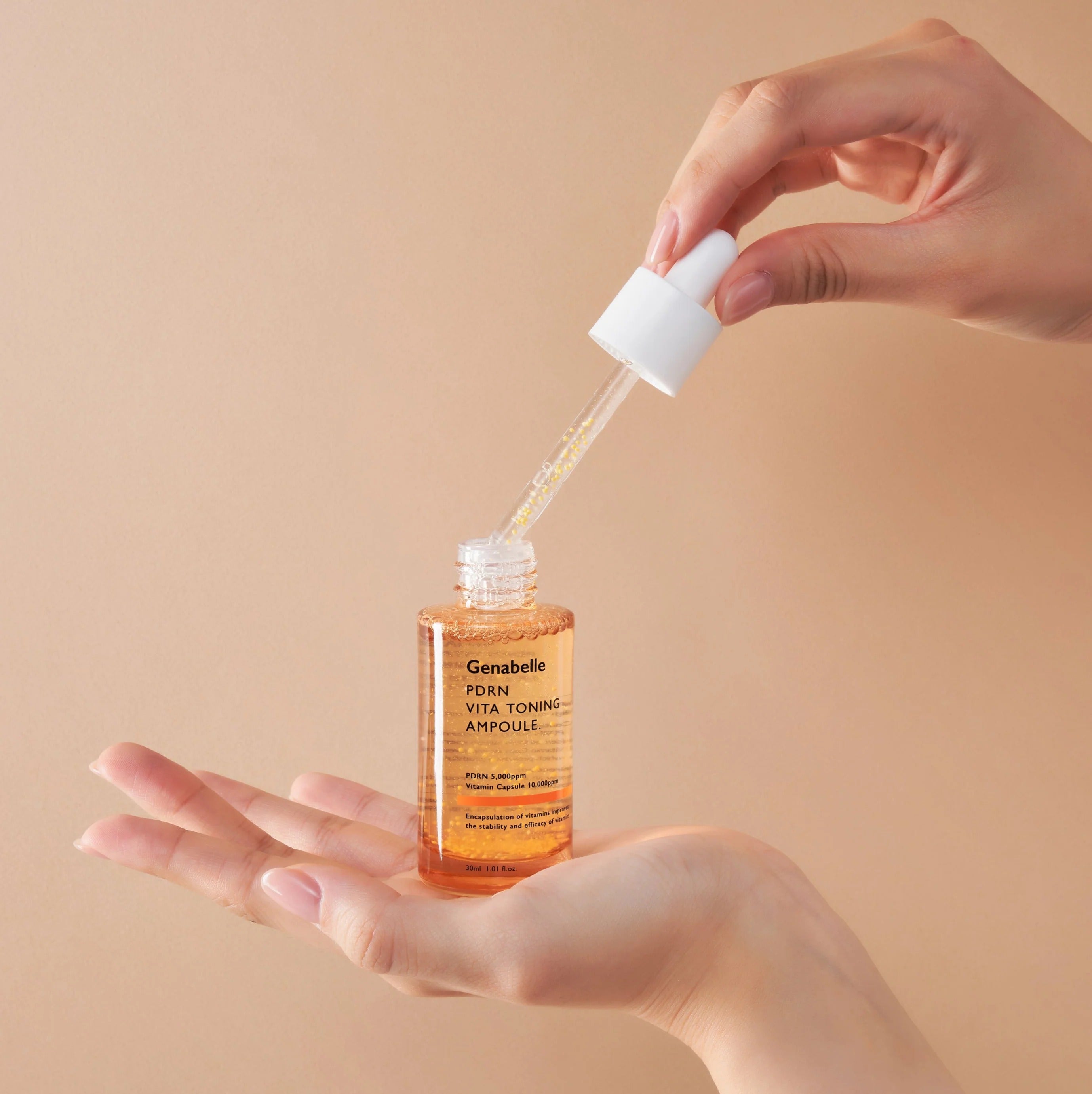 GENABELLE PDRN Vita Toning Ampoule 70ml being applied from dropper onto hand