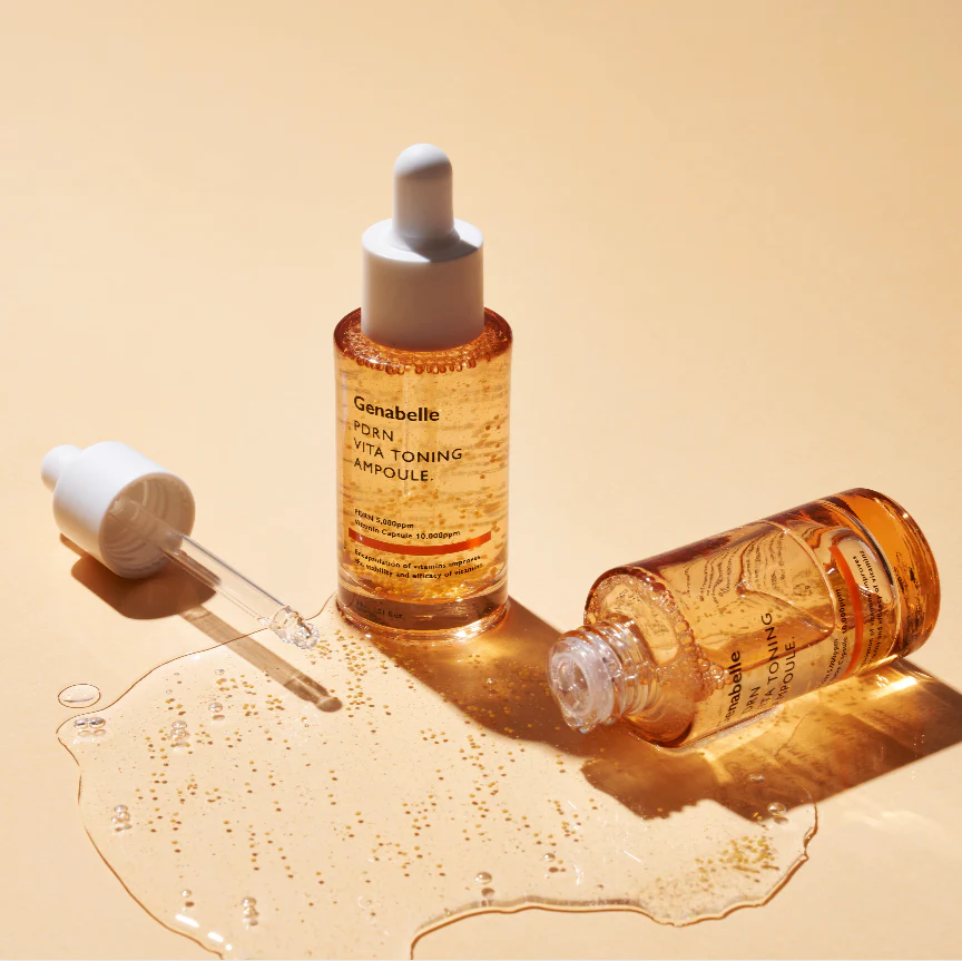 GENABELLE PDRN Vita Toning Ampoule 70ml with pipette and spilled liquid on a beige surface