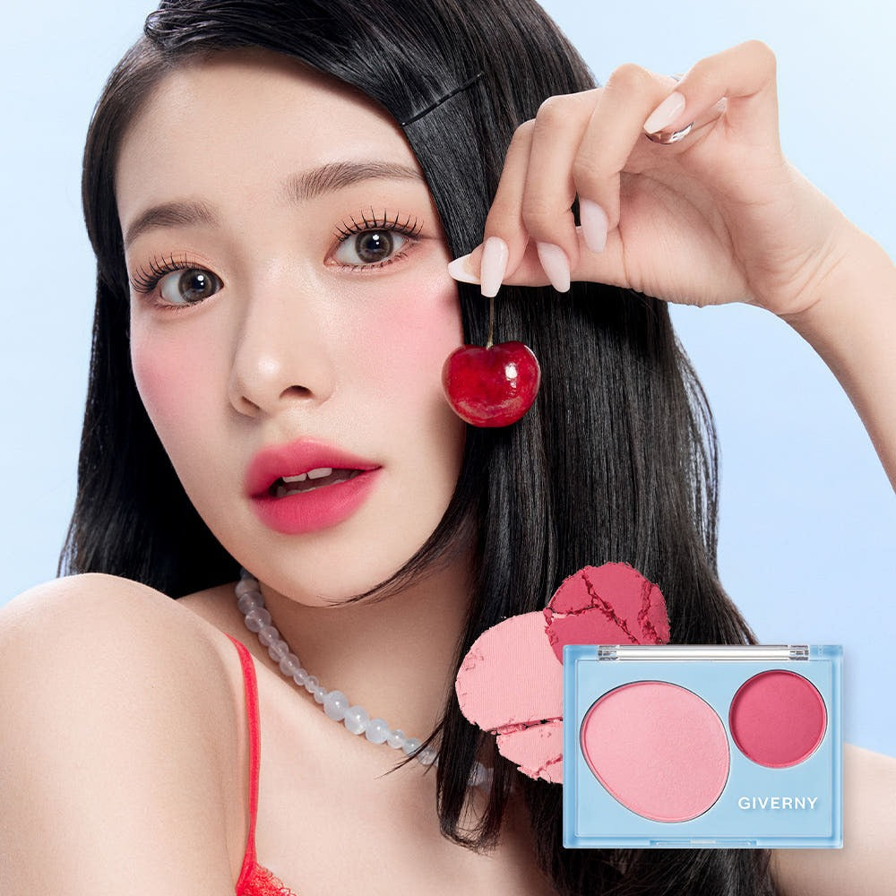 Model applying GIVERNY Fluffy Dual Blusher 7.4g with cherry accent, showcasing the vibrant and natural blush effect on cheeks.