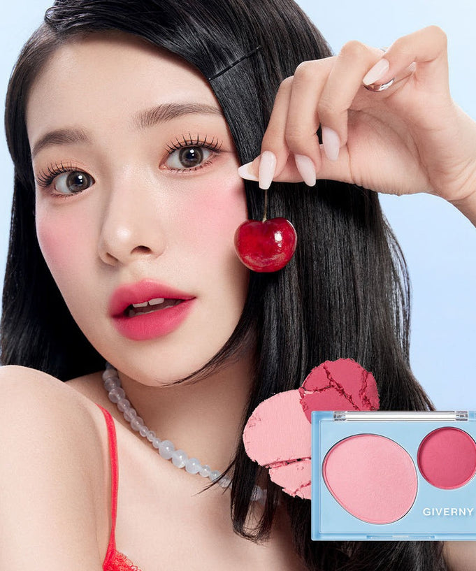Model applying GIVERNY Fluffy Dual Blusher 7.4g with cherry accent, showcasing the vibrant and natural blush effect on cheeks.