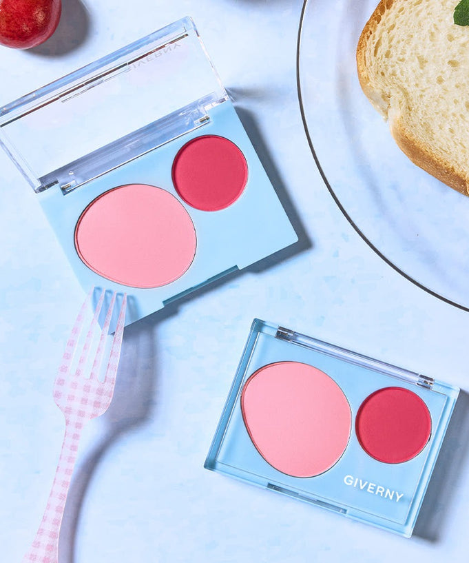 GIVERNY Fluffy Dual Blusher 7.4g, pink and red blush shades in a compact case beside a pink fork and bread slice.