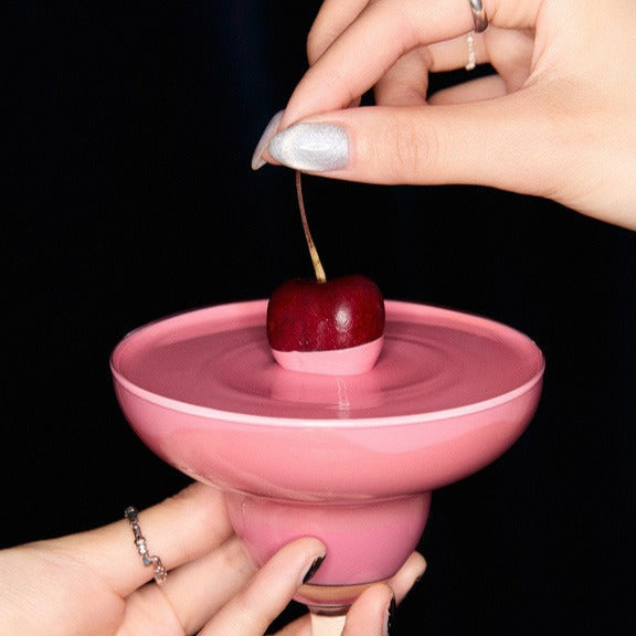 GLOW Cocktail Oil Blusher 7.5g in a unique cocktail-inspired pink container with a cherry on top, perfect for makeup enthusiasts.