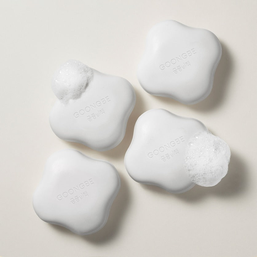 GOONGBE Pri-mmune Creamy Soap 90g bars with foamy lather on a neutral background, showcasing the product design and texture.
