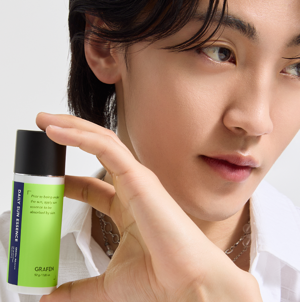 GRAFEN Daily Sun Essence 52g held by a Korean gentleman model, Gentleman Korea sun protection for men skincare