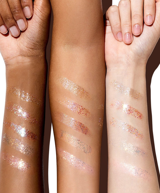 Three arms showcasing swatches of GLINT Glitter Gel in various shades, demonstrating versatile sparkle and shimmer effects.