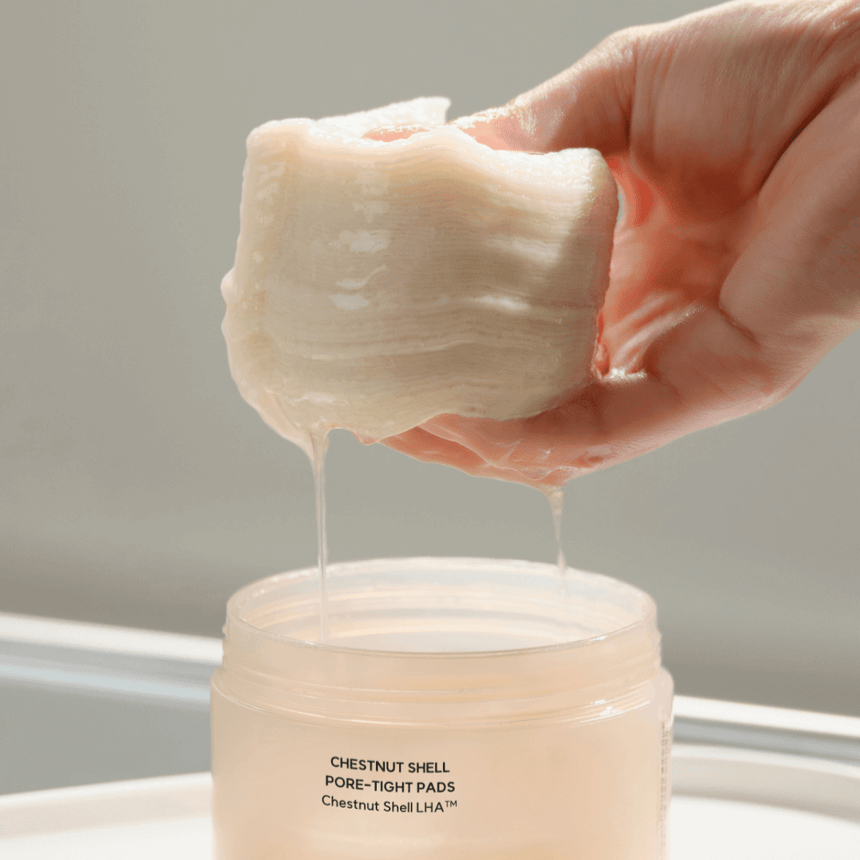 HANYUL Buddleberry Pore Tightening Pad for skincare, showing product texture and packaging.