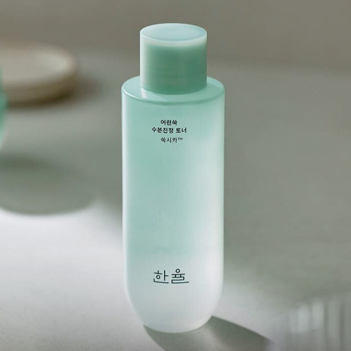 HANYUL Pure Artemisia Calming pH-Balancing Toner 150ml bottle on a table, ideal for skin hydration and pH balance.