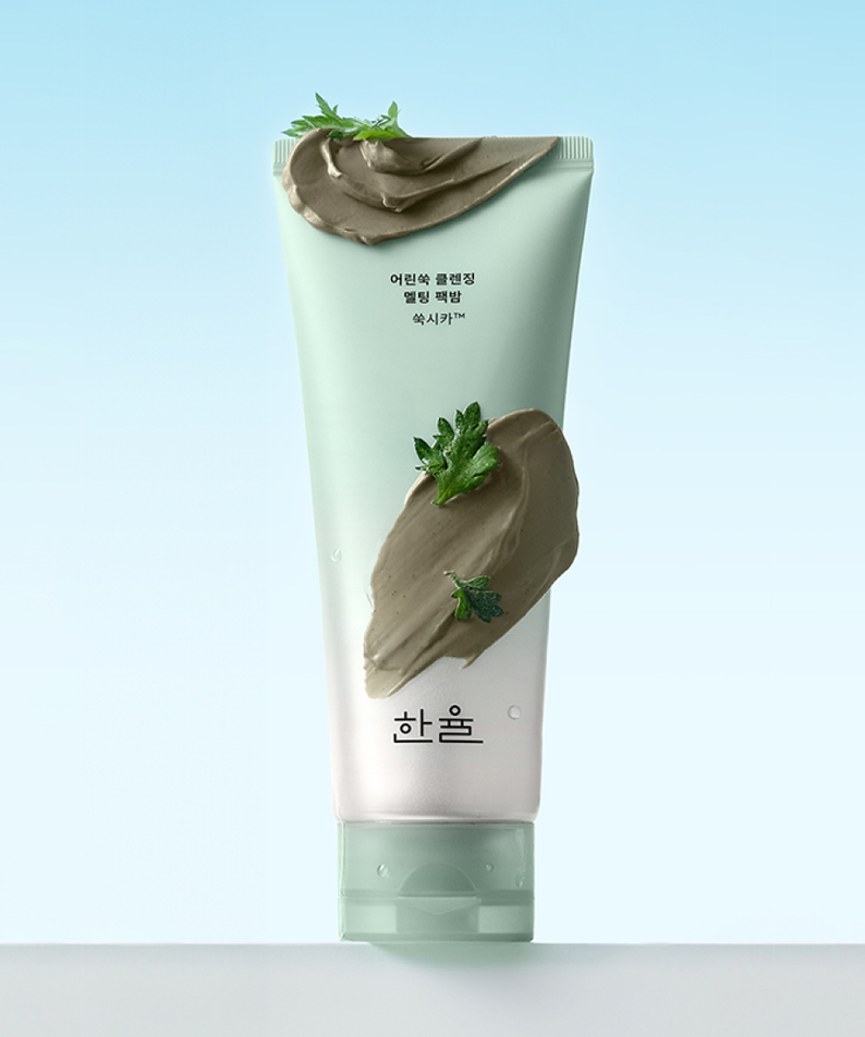 HANYUL Young Artemisia Cleansing Pack Balm 100g front view with texture and natural ingredients on light blue background.