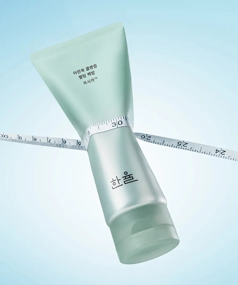 HANYUL Young Artemisia Cleansing Pack Balm 100g displayed against a blue background with a measuring tape.