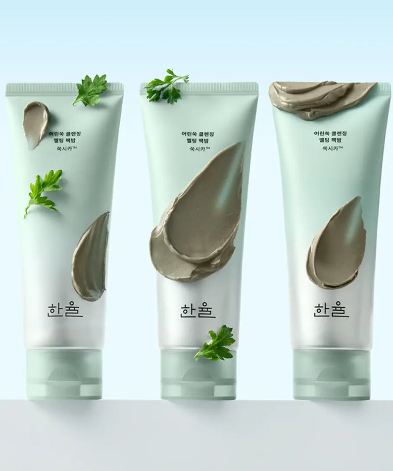 Three tubes of HANYUL Young Artemisia Cleansing Pack Balm 100g with green herbal accents on packaging, displayed on a light background.