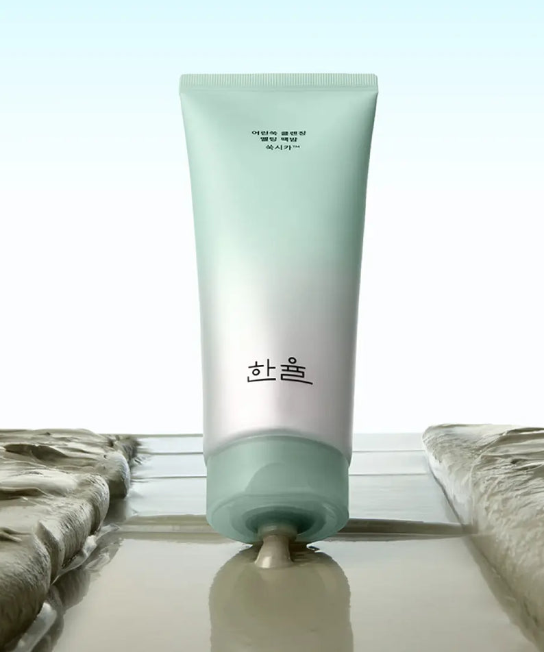 HANYUL Young Artemisia Cleansing Pack Balm 100g tube shown against a light background, highlighting the product texture and packaging.