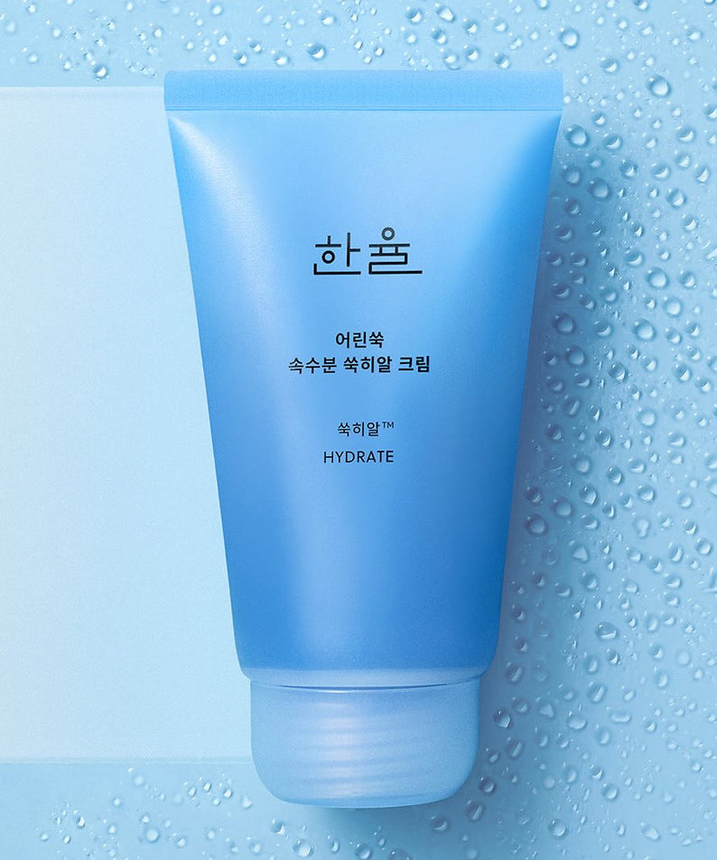 HANYUL Young Artemisia Extract Moisturizing Cream 60ml blue tube on wet surface background