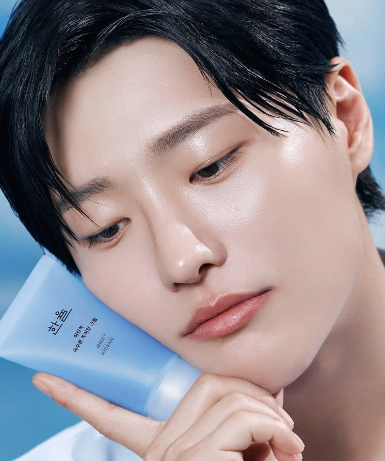 Person holding HANYUL Young Artemisia Extract Moisturizing Cream 60ml against face