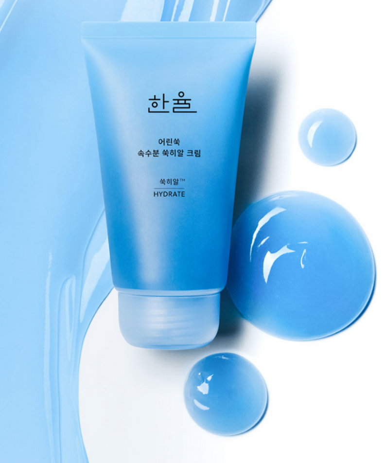 HANYUL Young Artemisia Extract Moisturizing Cream 60ml tube on blue background with texture and liquid drops