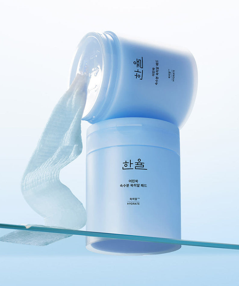 HANYUL Young Artemisia Extract Moisturizing Pad 60 Sheets in a blue container with pads for skincare hydration.