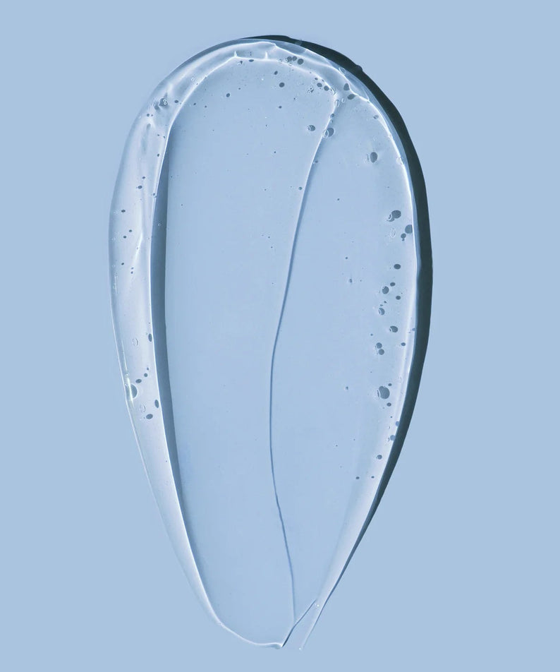 Texture of HARU HARU Black Rice Hyaluronic Essence 50ml on a blue background