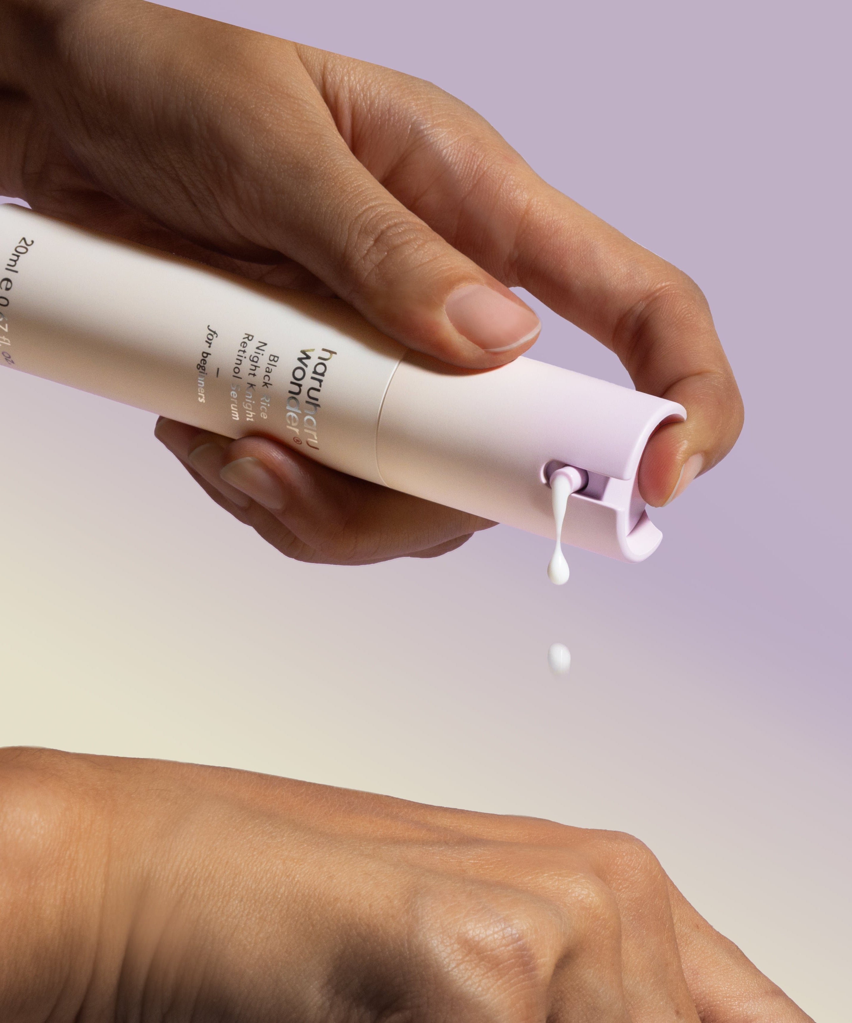 Applying HARUHARU Black Rice Night Night Retinol Serum 20ml on skin