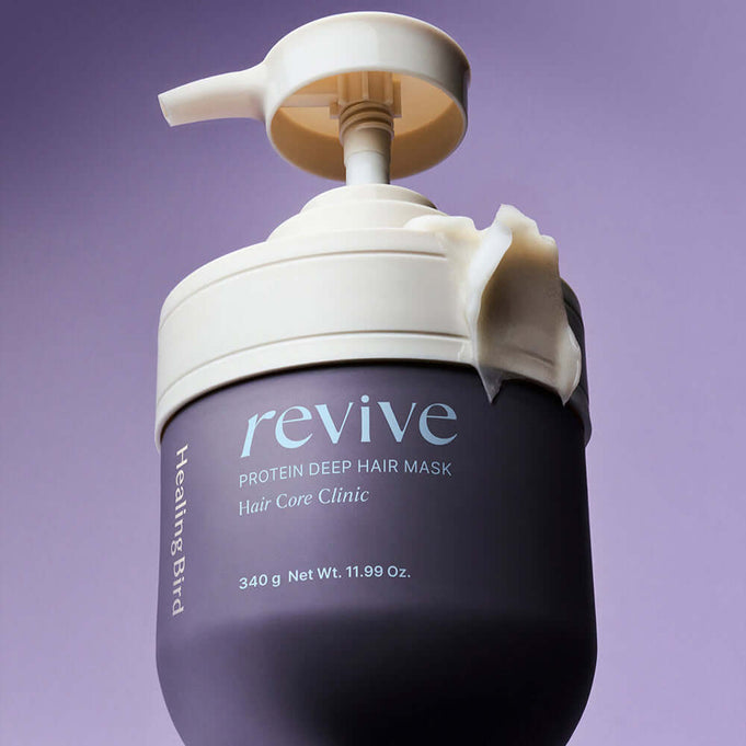 HEALING BIRD Revive Protein Shampoo + Deep Hair Mask bottle on purple background