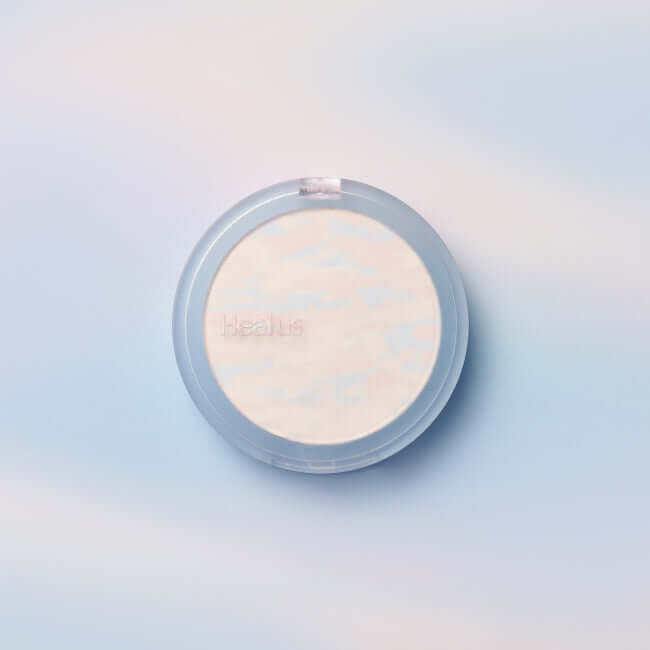 HEALUS Breath Cloud Powder compact against a soft cloud-like background
